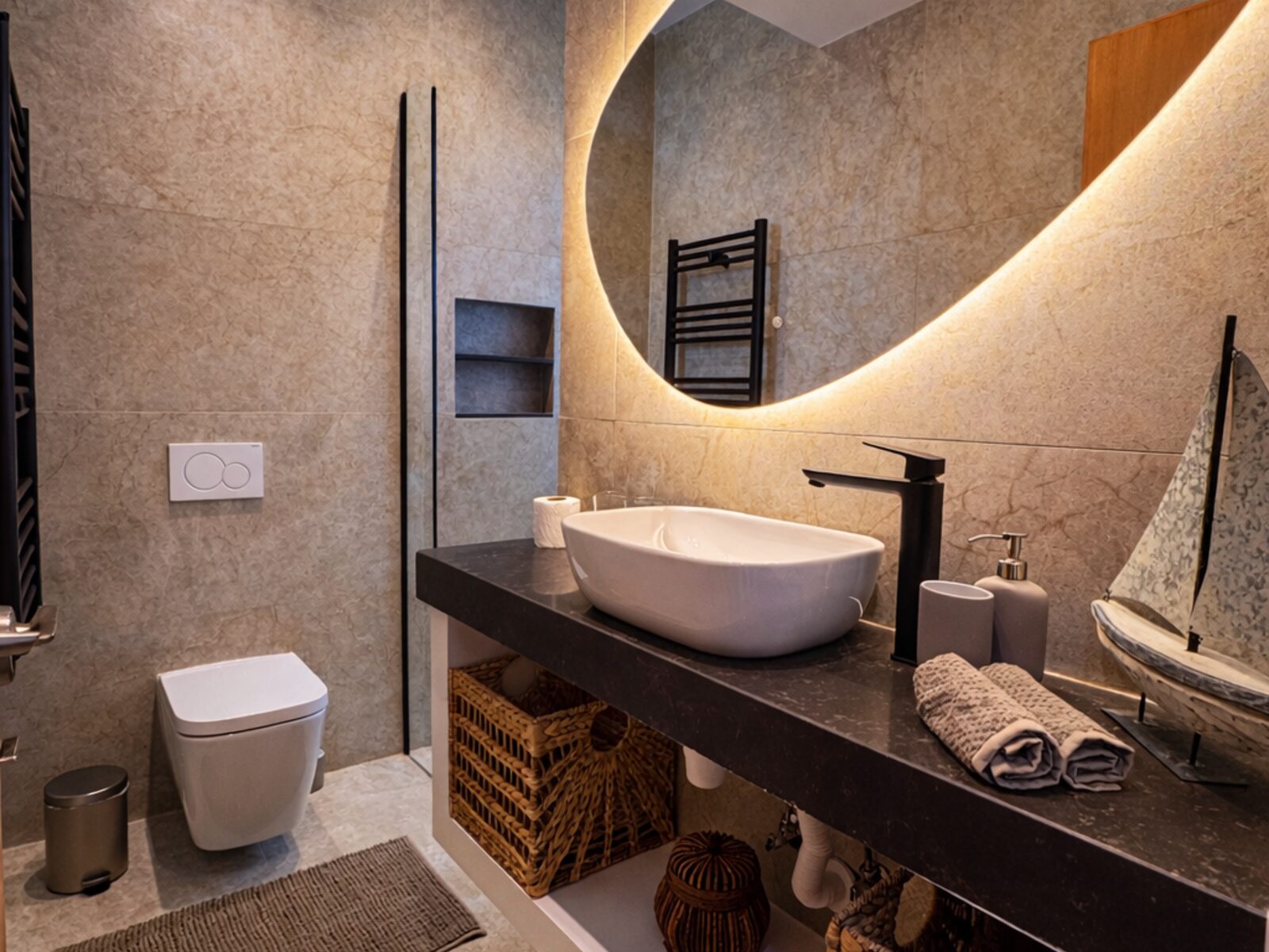 Pervolia bathroom after renovation, walk-in shower and backlit mirror