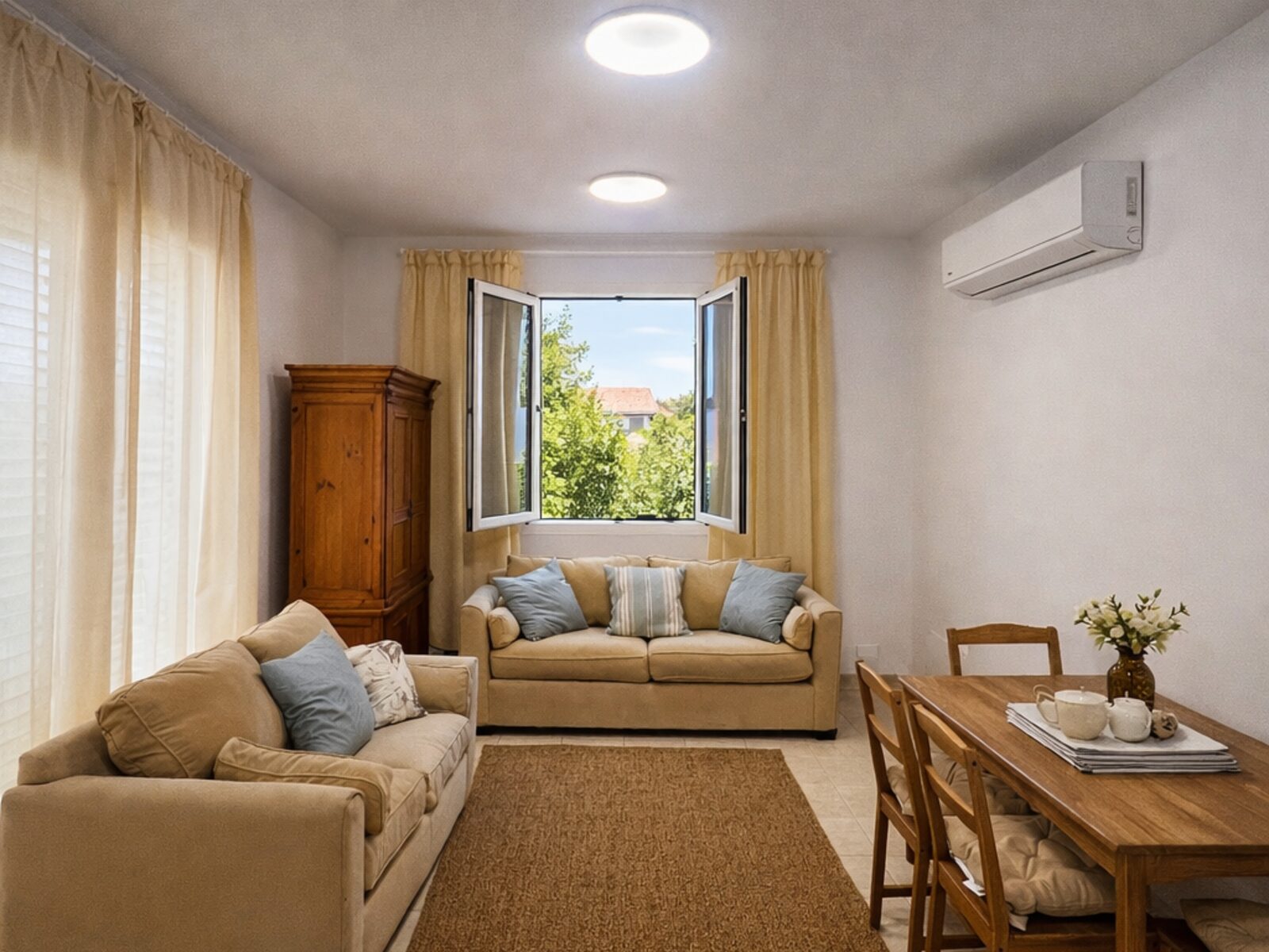 Pervolia living room after renovation, furnished for guests